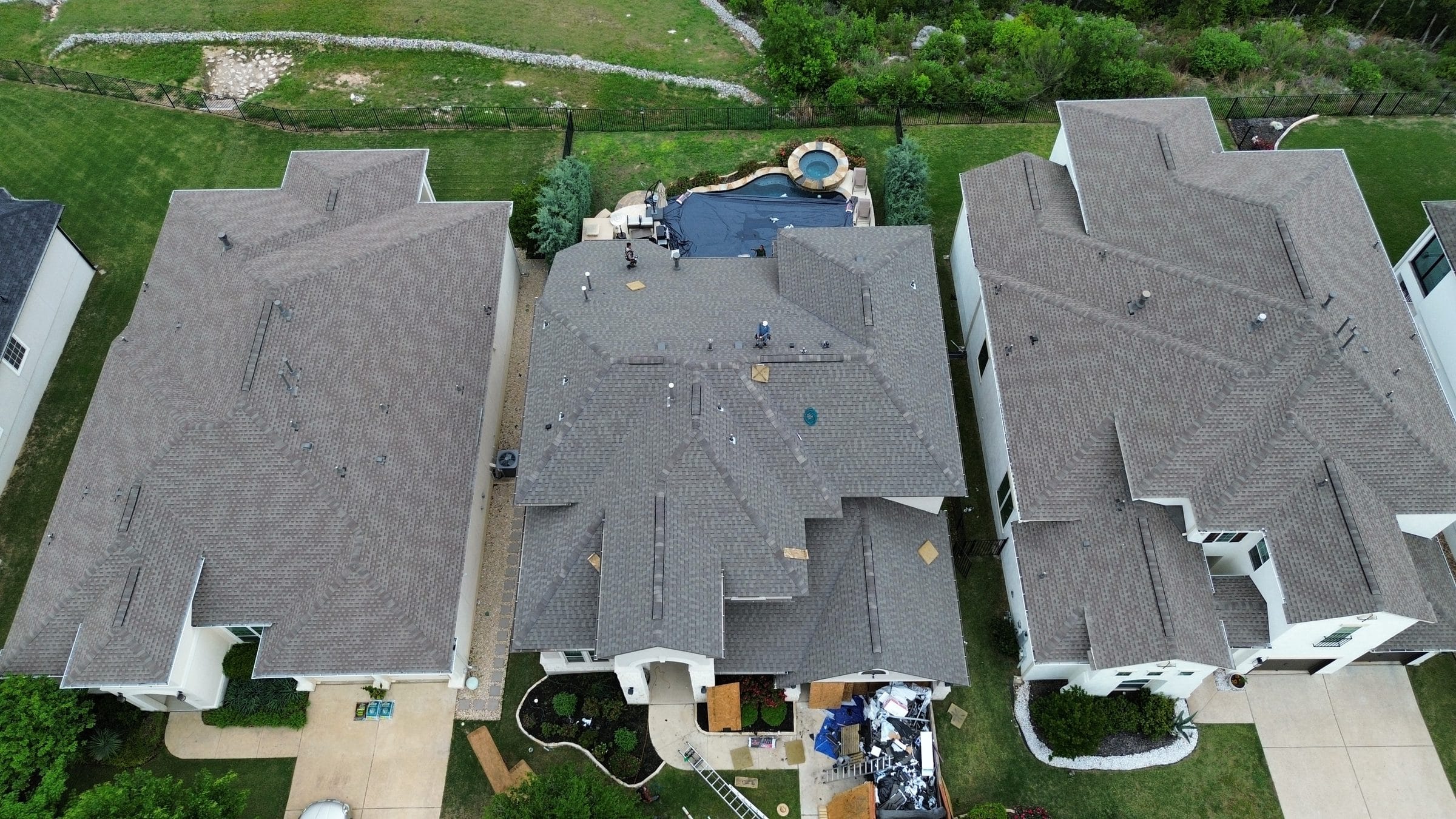 Roofing Company Austin TX | Residential Roof Replacement | Helix Roofing LLC Roofing company Austin TX, aerial view of a residential roof replacement in progress by Helix Roofing LLC, licensed Austin roofing contractor and roof replacement company serving Greater Austin